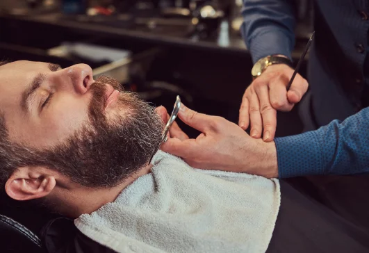 barber cutting beard